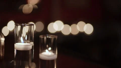 Flickering Candles Set Tranquil Mood, Tiered Glass Candle Holders Emit Soft Stock Footage 323772240