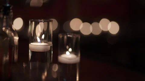 Flickering Candles Set Tranquil Mood, Tiered Glass Candle Holders Emit Soft Video stock 323772541