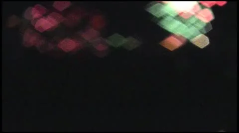 Flickering colored lights in the form of rhombuses on black background Bokeh Stock Footage 10683010
