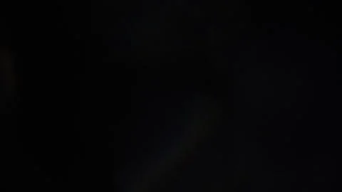 A flickering, dull blue light in the blackness 스톡 동영상 309253111