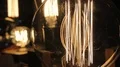 Flickering filament inside decorative Edison light bulbs, design, creativity HD Footage