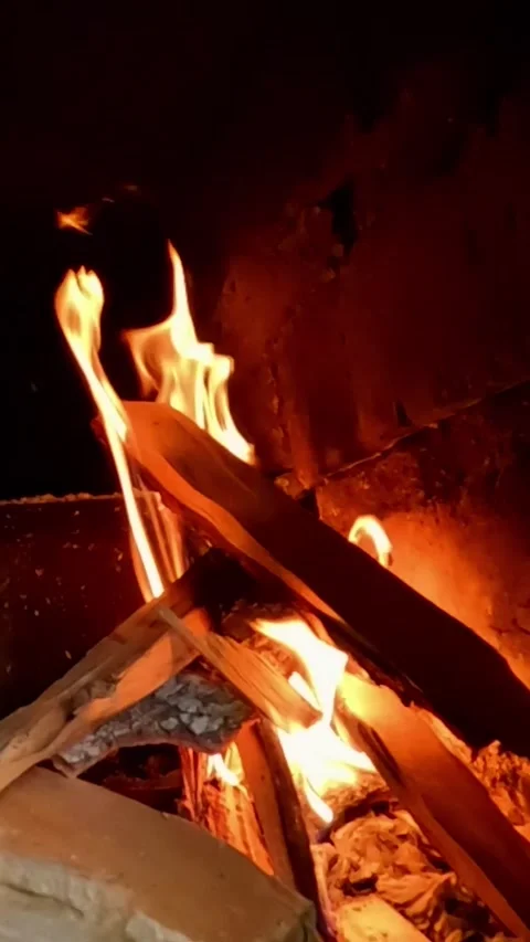 Flickering Fireplace Flames Around Stacked Firewood Close Up Stock Footage 324057111