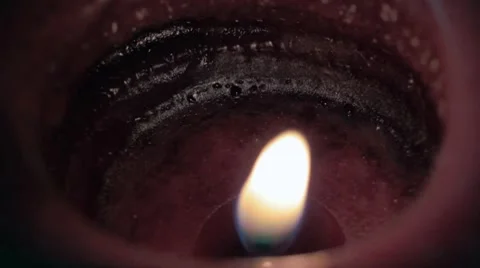 Flickering flame and red candle Stock Footage 8326949