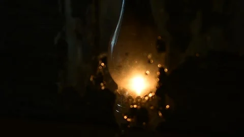 Flickering flame kerosene lamp, reflection in an old mirror Stock Footage 138390678