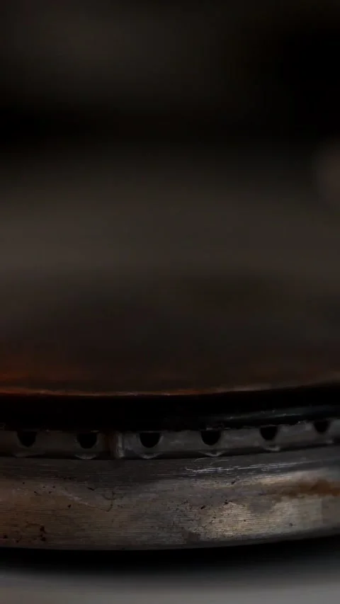 Flickering Flames Burst Across Circular Gas Stove Burner In Darkness. Thermal Stock Footage 346764591