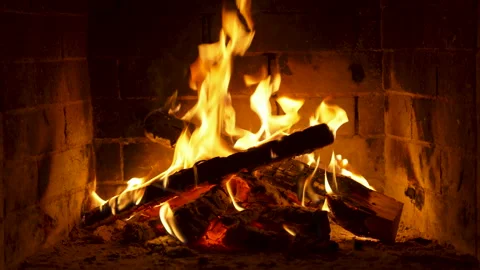 Flickering Flames Dancing in a Cozy Brick Fireplace. Stock Footage 290299514