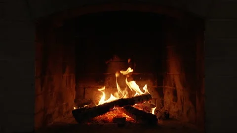 Flickering Flames Dancing in a Cozy Fireplace. Flames Dance in a Cozy Fireplace Stock Footage 323157821