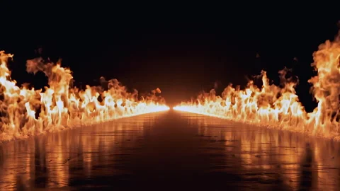The flickering flames illuminate a dark pathway, creating an intense and surreal Stock Footage 295890211