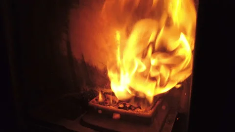 Flickering Flames. Mesmerizing Close-Up of Pellets Burning in a Stove Stock Footage 267414047
