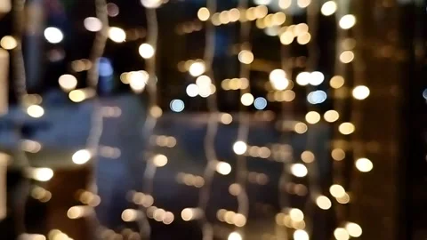 Flickering garland lights on a large store window. Blurred image with movement Stock Footage 258387176