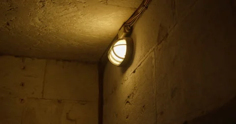 Flickering light bulb in an old dungeon Stock Footage 340516298