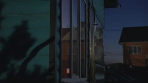 Flickering light in a window at dusk Stock Footage 341294671