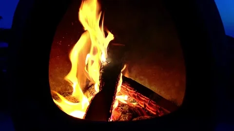 Flickering Orange Flames in a Fireplace at Dusk Stock Footage 288106490