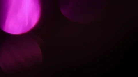 Flickering purple bokeh on the left side of the black 库存影片 309966769