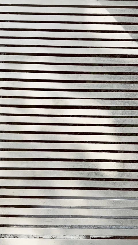 Flickering sun light on a metallic surface Stock Footage 316799995