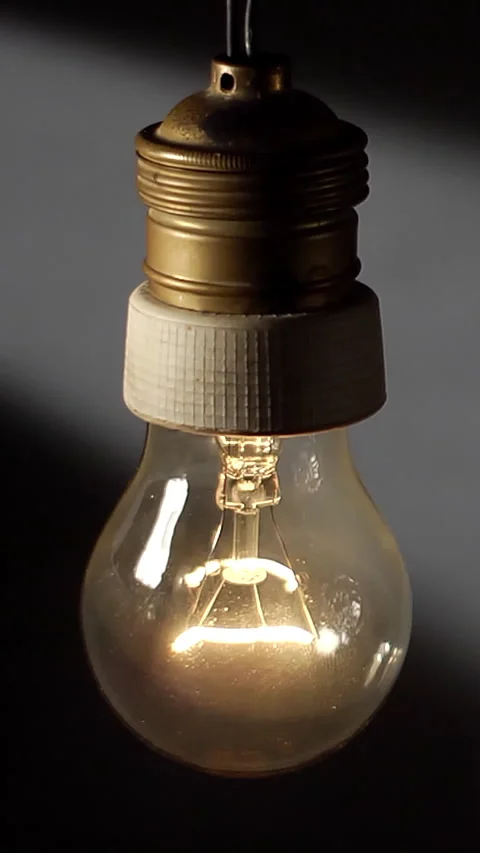 Flickering Swinging Bulb on Gray Background Stock-Footage 309086235