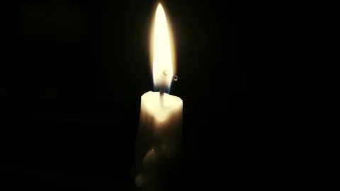 Flickering taper candle in a dark room Stock Footage 101072485