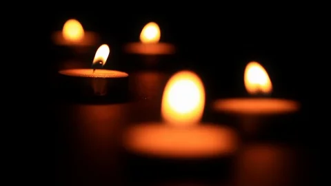 Flickering Tea Light Candles with Shallow Depth of Field Stock Footage 100577452