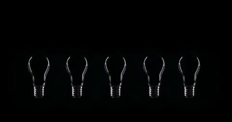 Flickering Tungsten light bulb lamp over black background Video stock 101949290