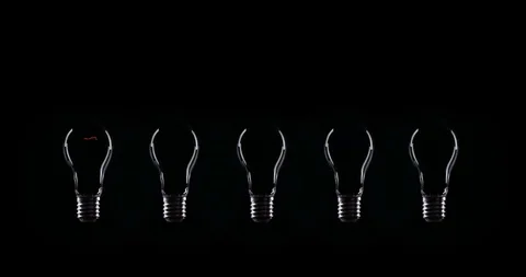 Flickering Tungsten light bulbs lamp over black background Stock Footage 101945769