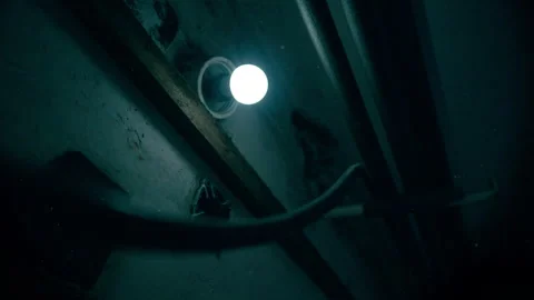 Flickering wall bulb revealing cellar pipes background Stock Footage 329142619