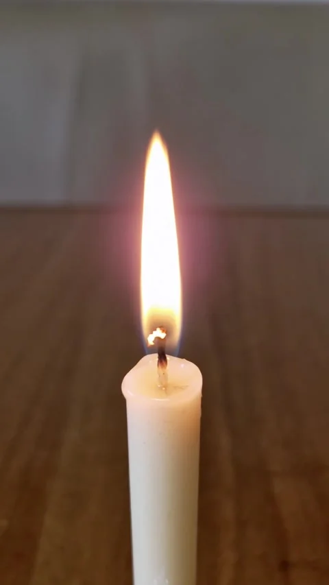 Flickering white candle flame close-up Stock Footage 319013736