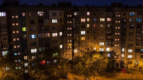 Flickering windows. Turn on and off the light. People come from work Stock Footage 97648332