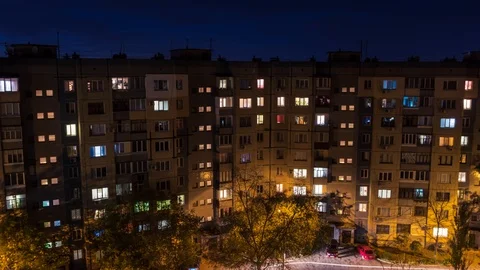 Flickering windows. Turn on and off the light. People come from work. 4k Stock Footage 97698887