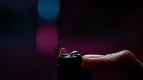 Flicking a Lighter with a Thumb in Macro and Slow Motion. Stock Footage 271007605