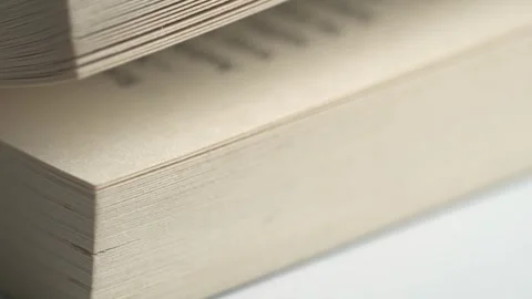 Flicking through old book pages, close-up. Slow motion of flicking through .. Stock Footage 262256565