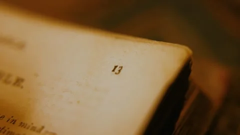 Flicking Through Pages To Number Thirteen 動画素材 284760319