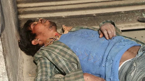 Flies on face of sleeping Indian man laying at street in Jodhpur, closeup. Stock Footage 50077649