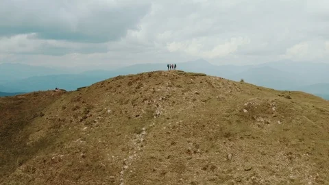 The flight above active people on a mountain Stock Footage 116076076