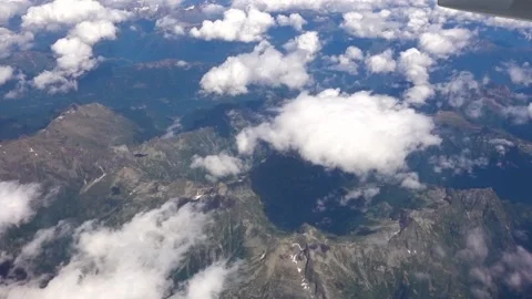 A flight above the Alps with views of the mountains from the plane. Stock Footage 132563209