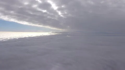 Flight above the clouds in 4k Stock Footage 153364289