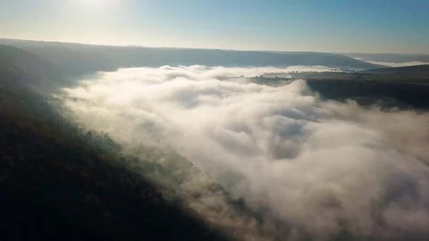 Flight above the clouds above the river Stock Footage 115508575
