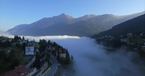 Flight above the clouds in an Alpine valley. Stock Footage 104708294