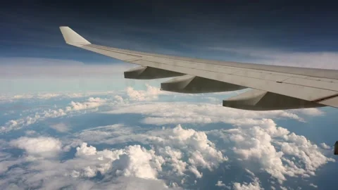 Flight above the clouds with a breathtaking view of an airplane wing Stock Footage 273018097