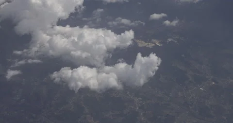 Flight above the clouds, earth in the background, 4K Stock Footage 221265303