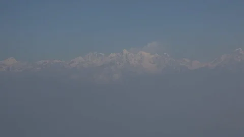 Flight above clouds with Himalayas in distance 스톡 동영상 101442810