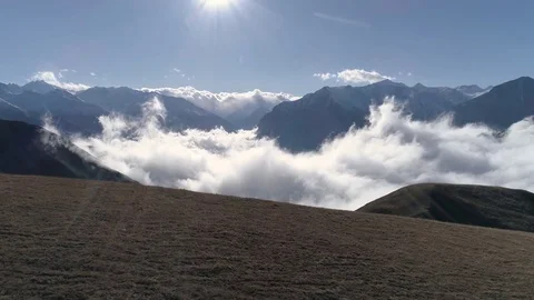 Flight above the clouds in the mountains Stock-Footage 83726607