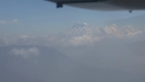 Flight above clouds with propeller in foreground and Himalayas in distance Video stock 101442868