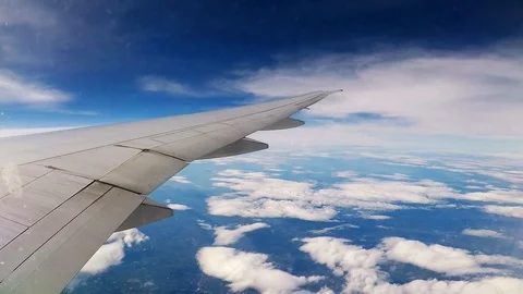 Flight above the clouds, view from the eluminator of the plane Stock Footage 127530782