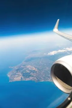 Flight above the clouds. A view of Malta. Crossing the sea. High image quality. Stock Photos