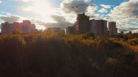 Flight above construction site with building cranes and other equipment Stock Footage 95631176