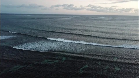 Flight above distant waves in Mauritius Stock Footage 113476404