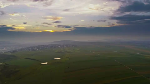 The flight above the field on the sunset background. quadrocopter shot Stock Footage 92761039