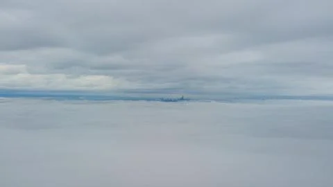 Flight above fog between the clouds Stock Photos