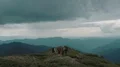 The flight above four hikers on the mountain 4k or 4k+ Resolution