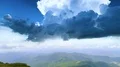 The flight above the four people on the mountain 4k or 4k+ Resolution